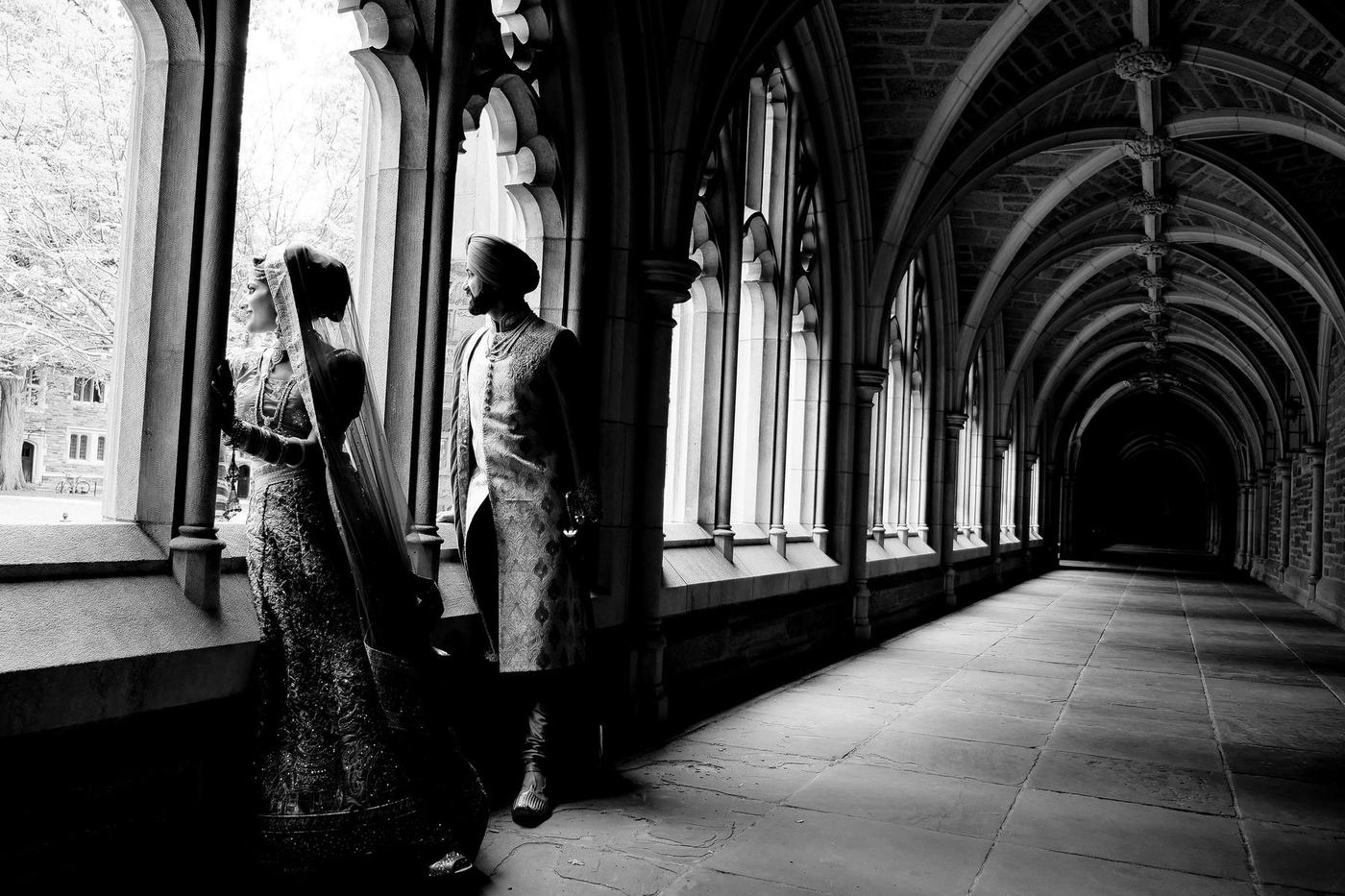 Sikh couple in a stone cloister, in black and white